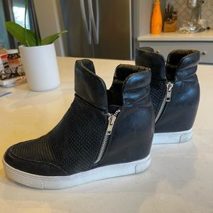 Steve Madden side zip sneakers.